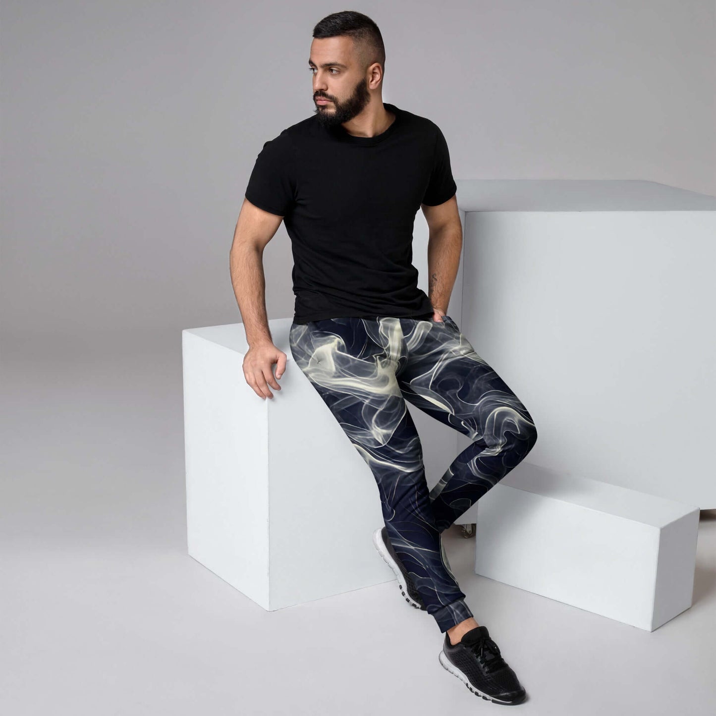 Smokey Men's Joggers for Comfort worn by a man sitting on a block with a black t-shirt.