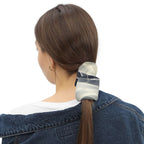 Woman wearing a smoke pattern gaiter as a hair accessory in a casual outfit.