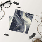 Smoke pattern gaiter displayed on a light background with black glasses and Halloween decorations.