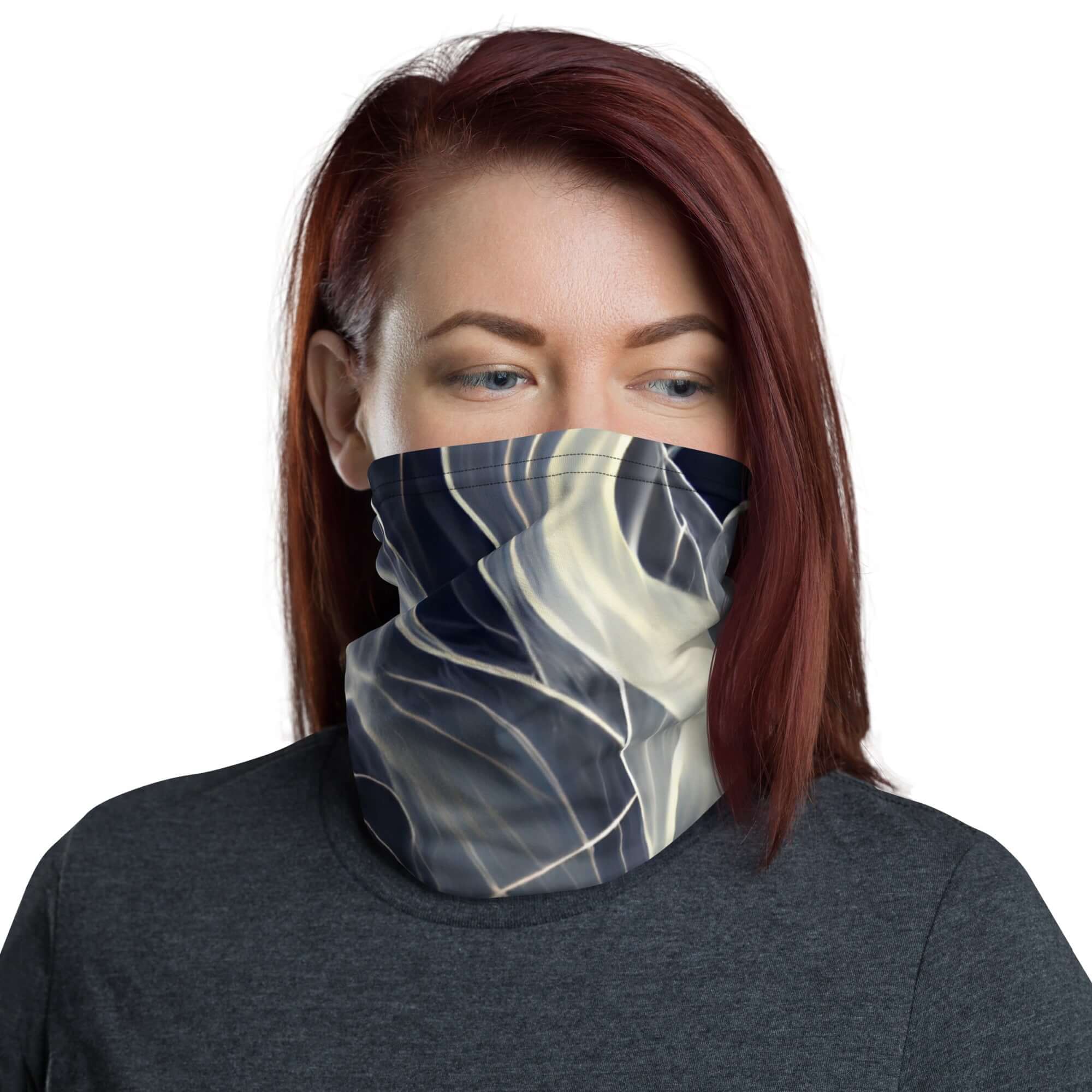 Woman wearing a smoke pattern gaiter as a face covering, showcasing versatile style and comfort.