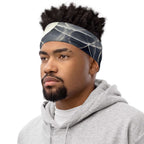 Smoke pattern gaiter worn as a headband by a man in a gray hoodie, showcasing its stylish design.