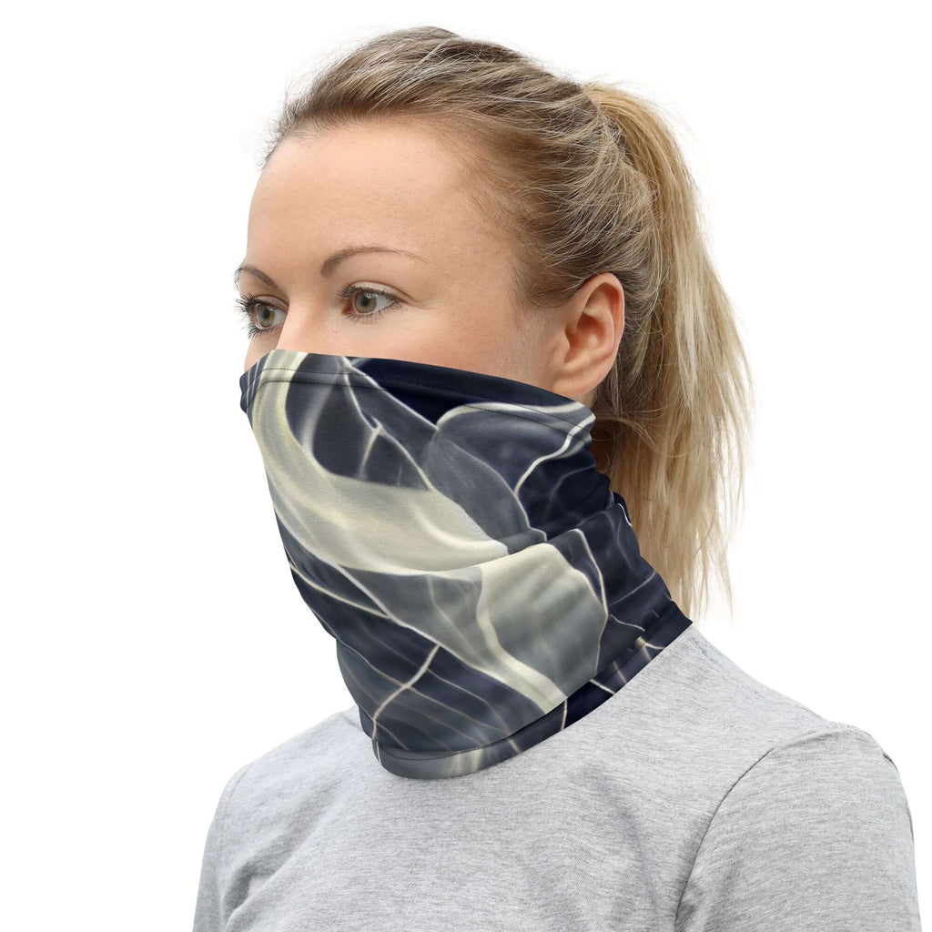 Woman wearing a smoke pattern gaiter as a neck warmer for outdoor activities and style.