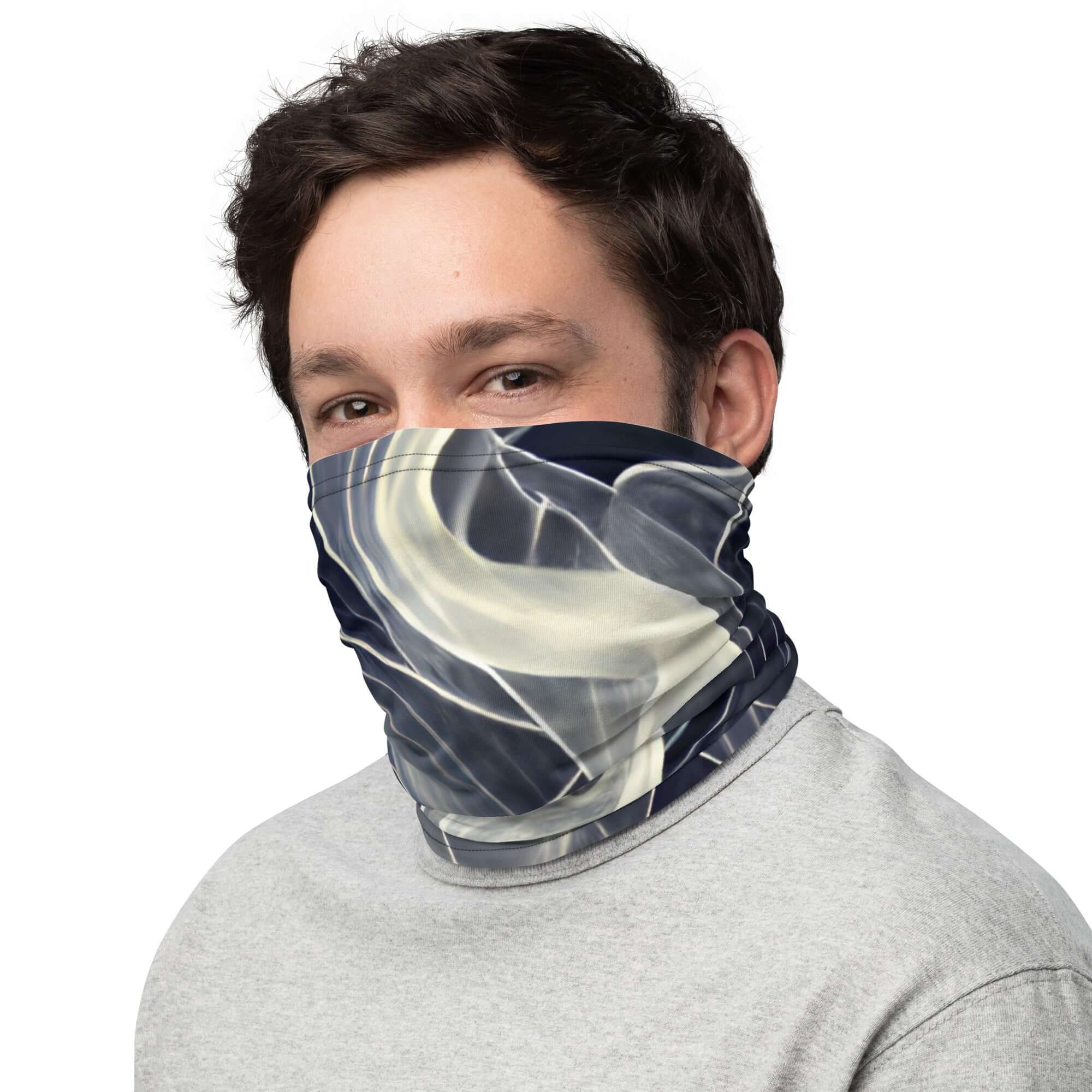 Man wearing a Smoke pattern gaiter for face covering and neck warmth, showcasing versatile outdoor accessory.