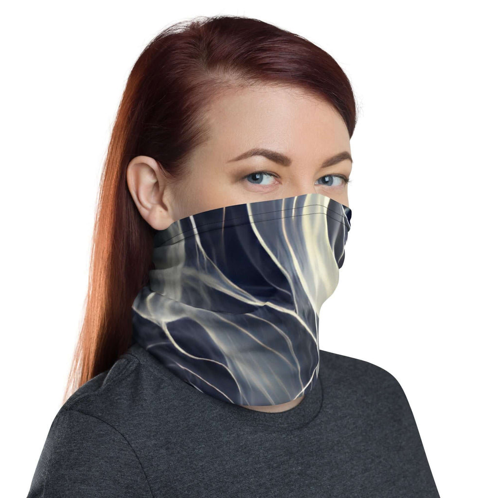 Woman wearing a Smoke pattern gaiter as a face covering and neck warmer, stylish and versatile accessory.