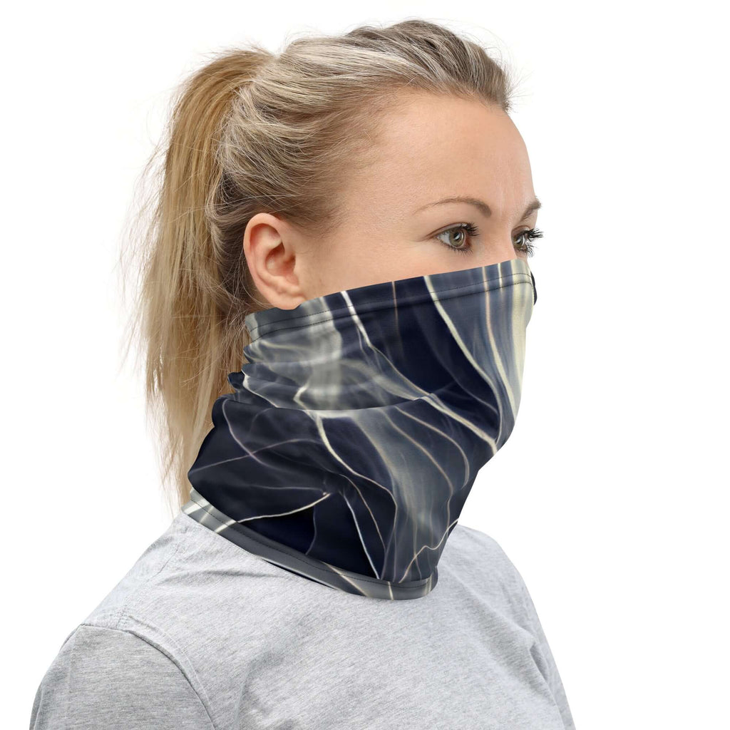 A woman wearing a smoke pattern gaiter as a stylish face covering for outdoor activities.