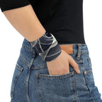 Smoke pattern gaiter worn as a stylish wristband accessory with a casual outfit.