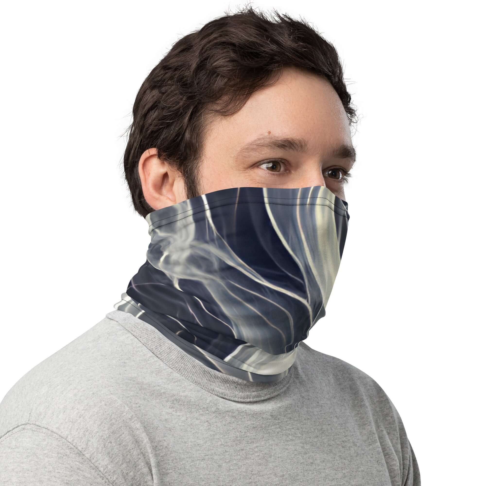 Smoke pattern gaiter worn as a face covering by a person, showcasing its stylish design and versatility.