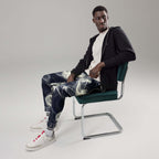 Smokey Men's Joggers for Comfort worn by a model sitting on a chair, styled with a casual look.