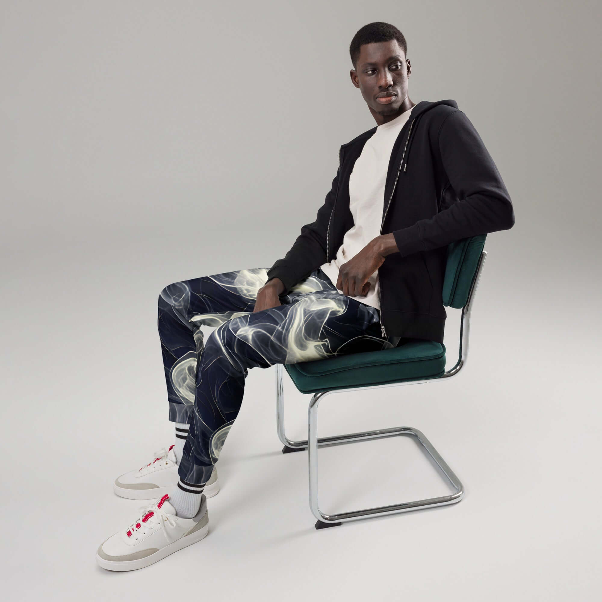 Smokey Men's Joggers for Comfort worn by a model sitting on a chair, styled with a casual look.