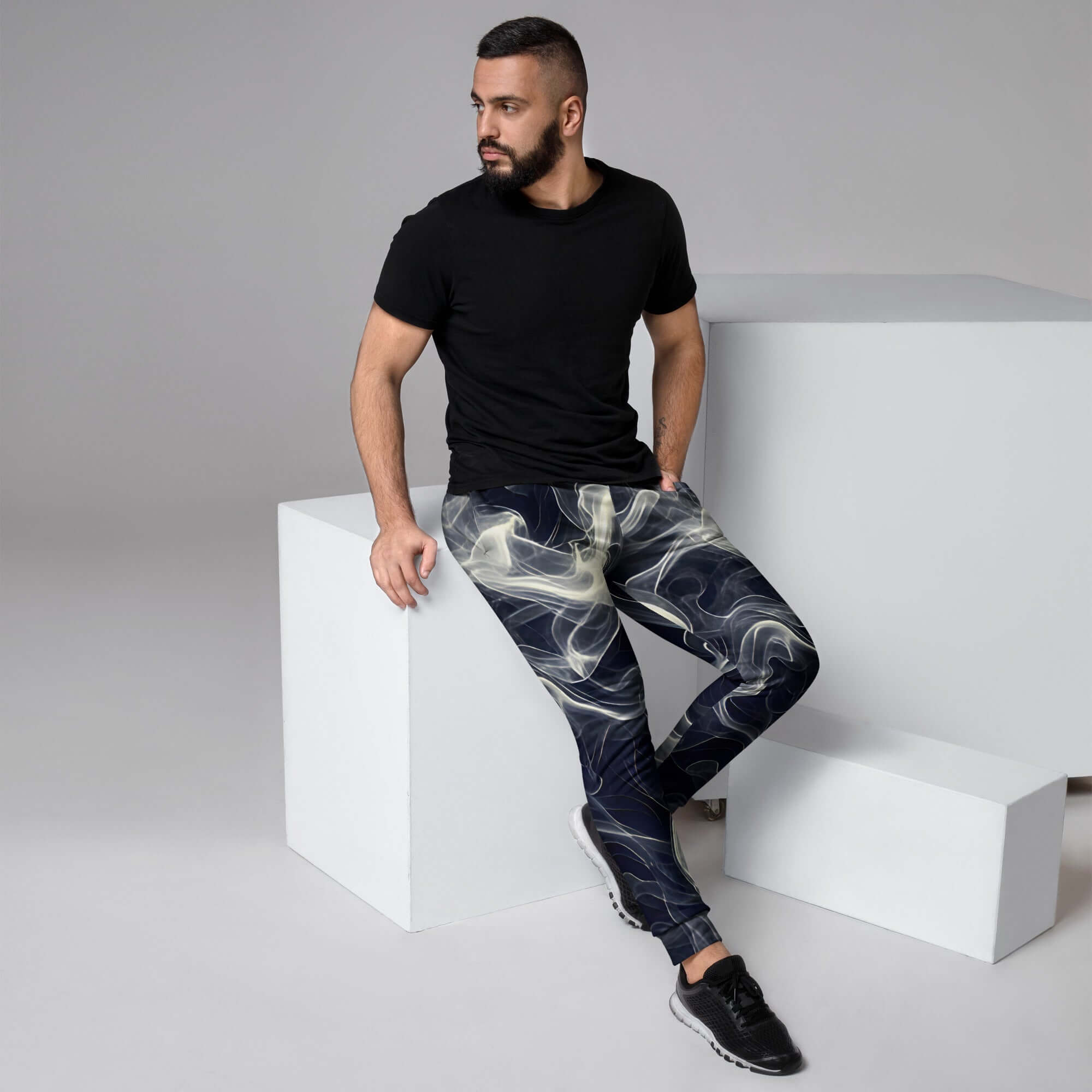 Smokey Men's Joggers for Comfort worn by a man sitting on a block with a black t-shirt.