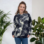 Smokey Unisex Hoodie for Stylish Streetwear Enthusiasts on a model surrounded by plants.