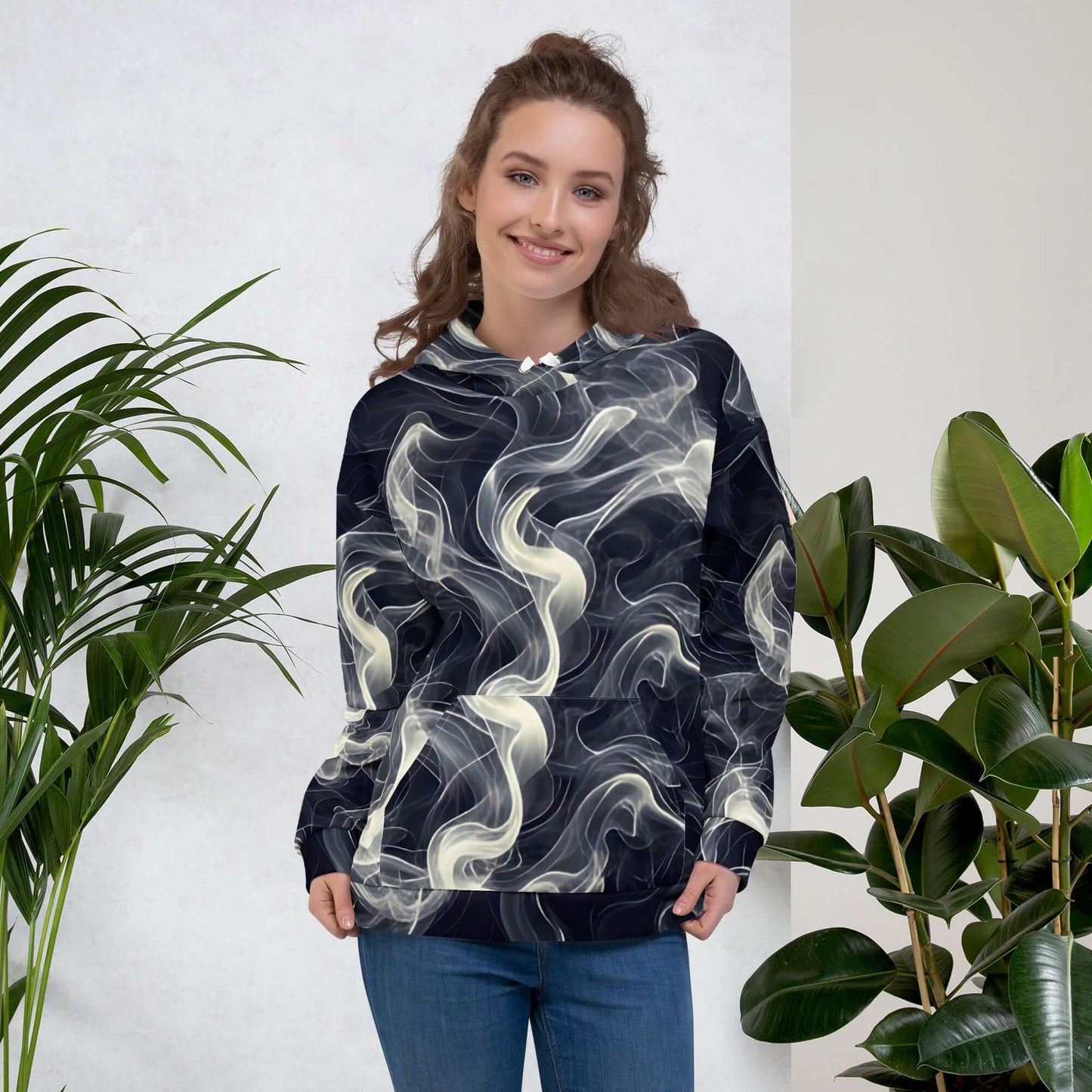 Smokey Unisex Hoodie for Stylish Streetwear Enthusiasts on a model surrounded by plants.