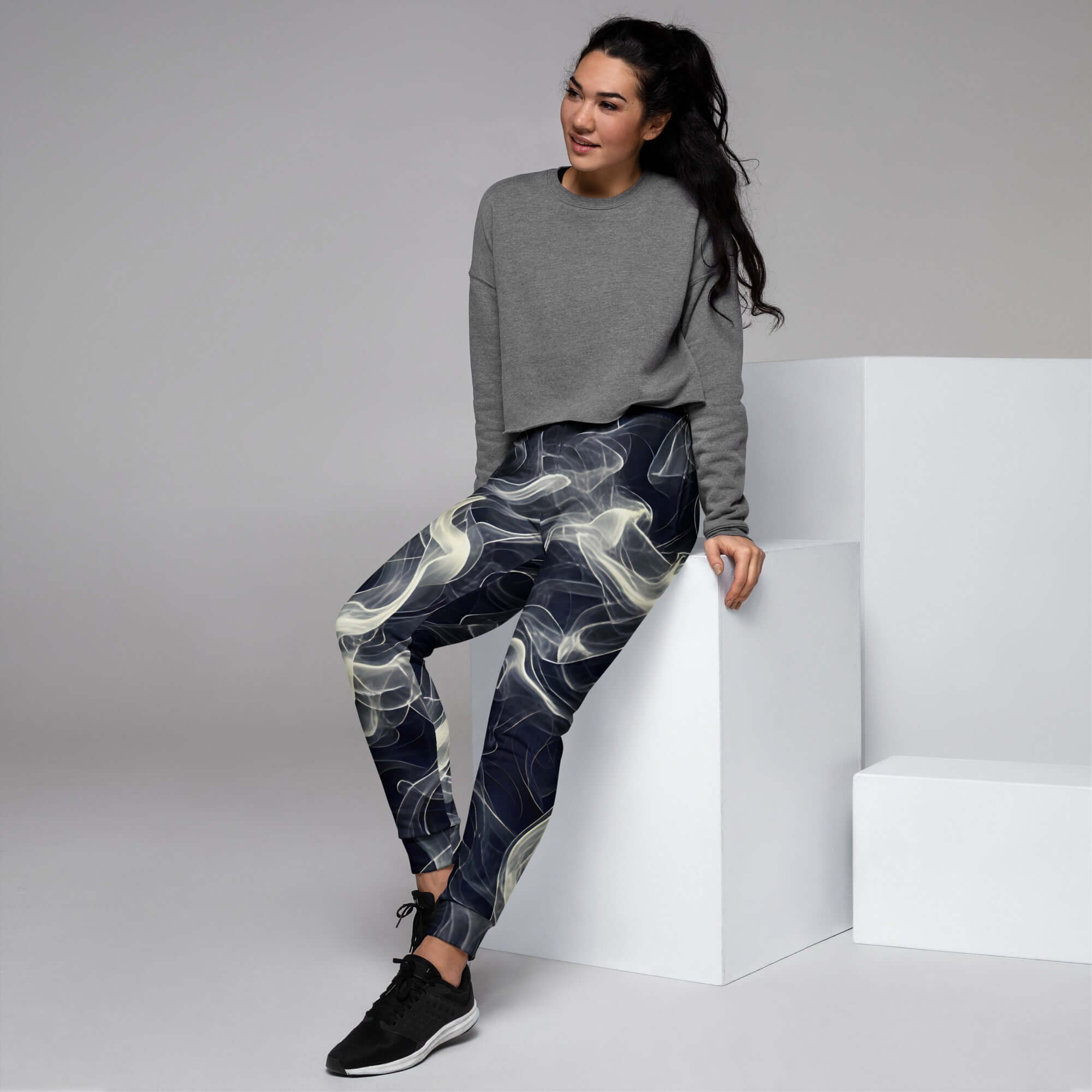 Smokey Women's Joggers Comfort Meets Style in Streetwear worn with a casual gray sweatshirt and sneakers.
