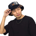 Young man wearing a reversible bucket hat streetwear, styled for versatility and comfort in a casual outfit.