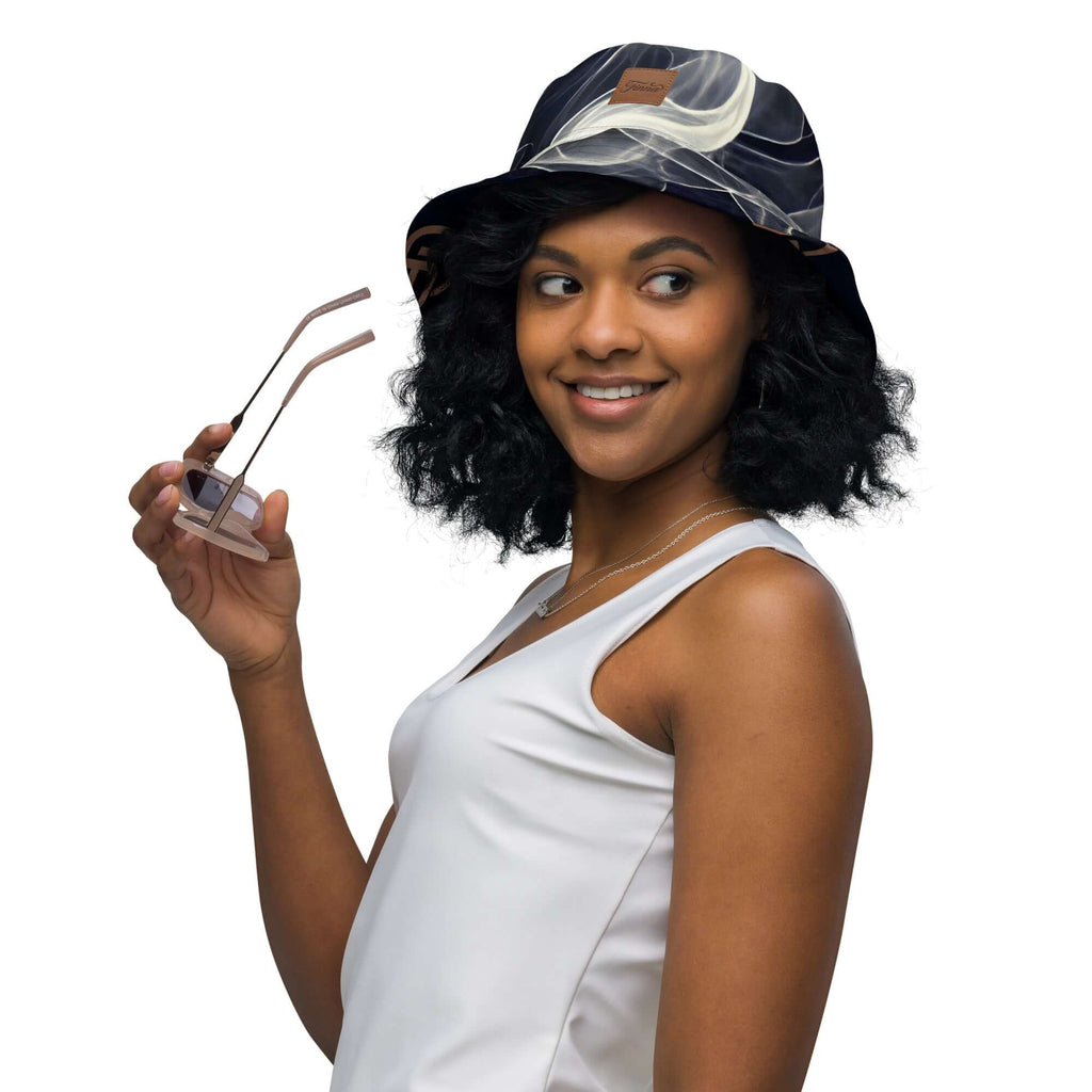 Reversible bucket hat streetwear worn by a woman holding sunglasses, showcasing a stylish streetwear look.