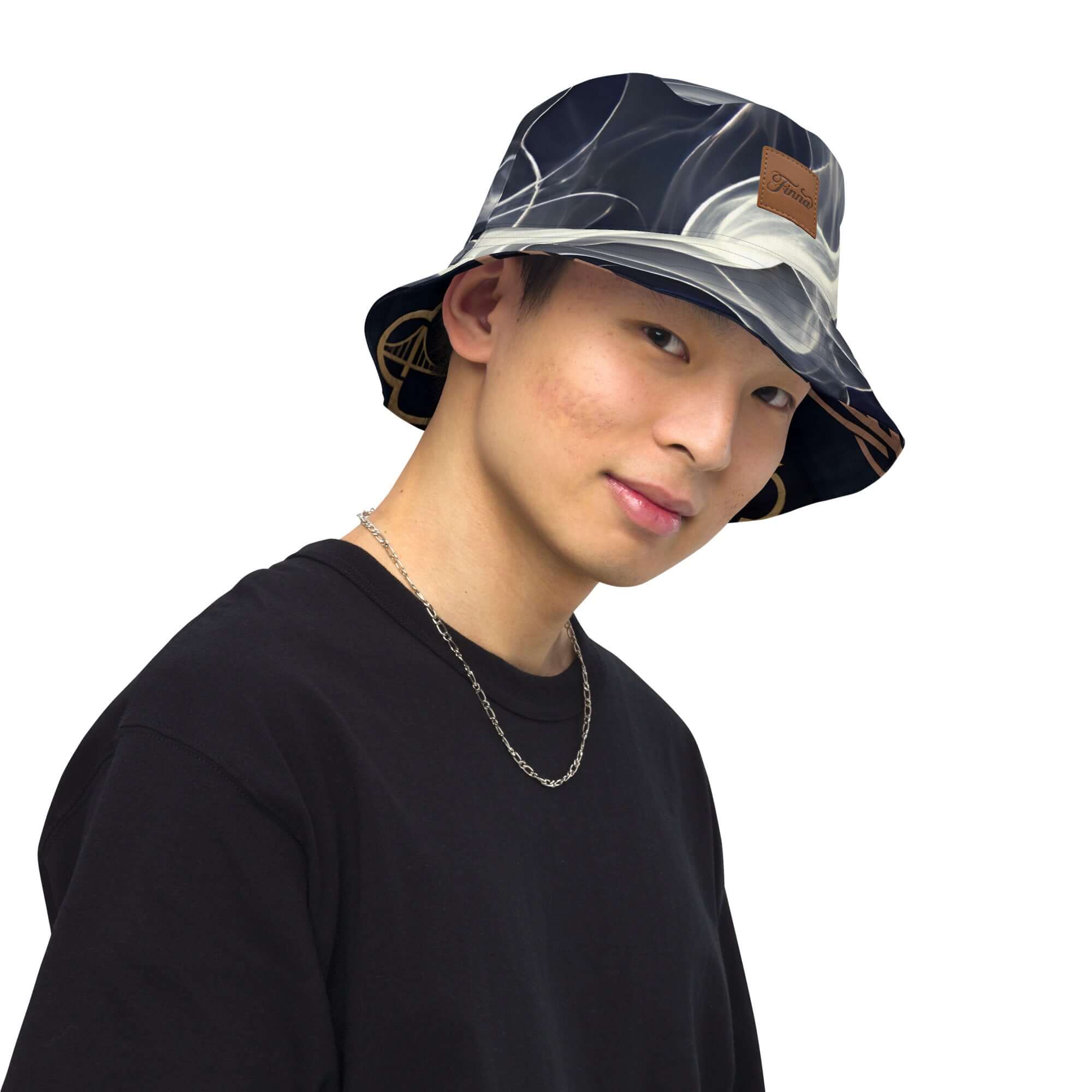 Young man wearing a reversible bucket hat streetwear, showcasing its stylish design and versatility.