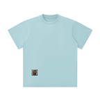 Spronkey Unisex Lightweight Oversized T-Shirt featuring a unicorn graphic and crown design on a gray background.