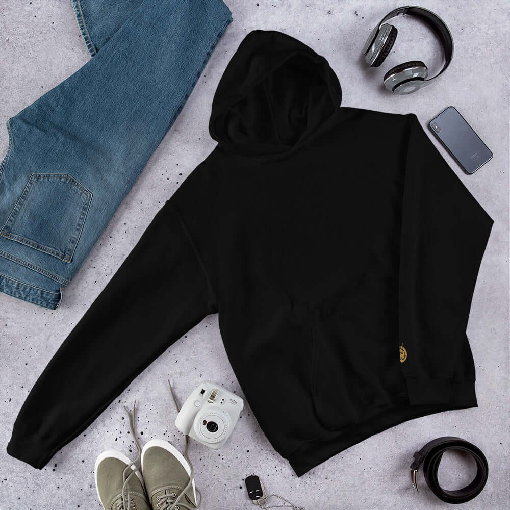 Lynxdonk Unisex Hoodie Cozy and Stylish Essential in black, styled with jeans and casual accessories.