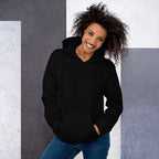 Lynxdonk Unisex Hoodie Cozy and Stylish Essential in black, modeled by a smiling woman against a geometric background.