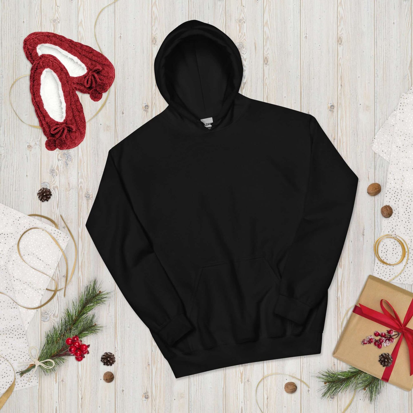 Lynxdonk Unisex Hoodie Cozy and Stylish Essential in black surrounded by festive decorations.