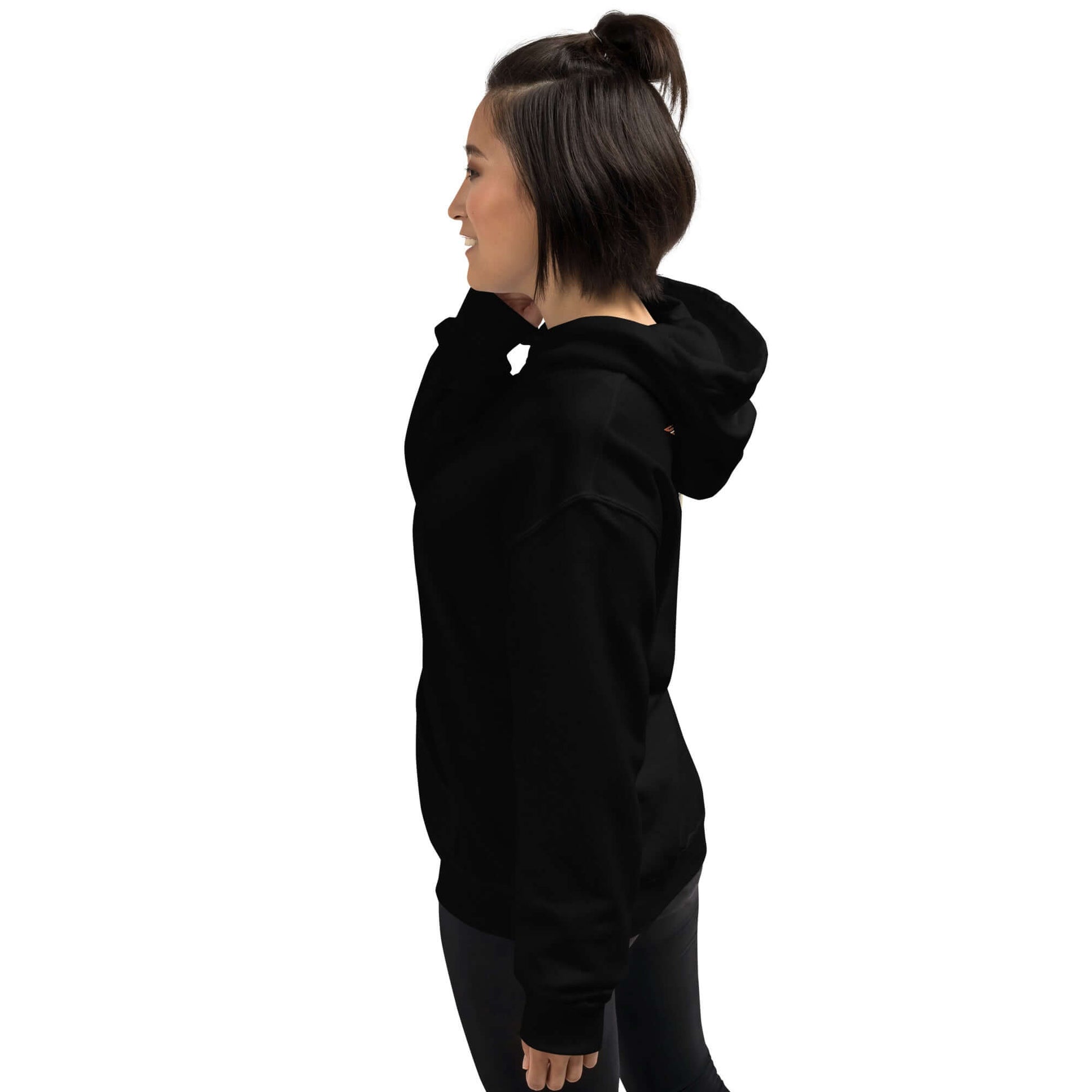Lynxdonk Unisex Hoodie Cozy and Stylish Essential shown on a model from the side in black color.