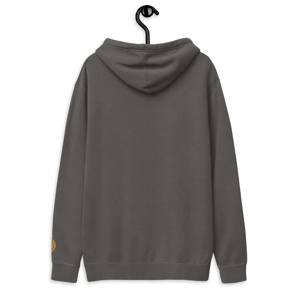 Back view of LynxDonkey Unisex pigment-dyed hoodie hanging on a display hook, showcasing its casual style.