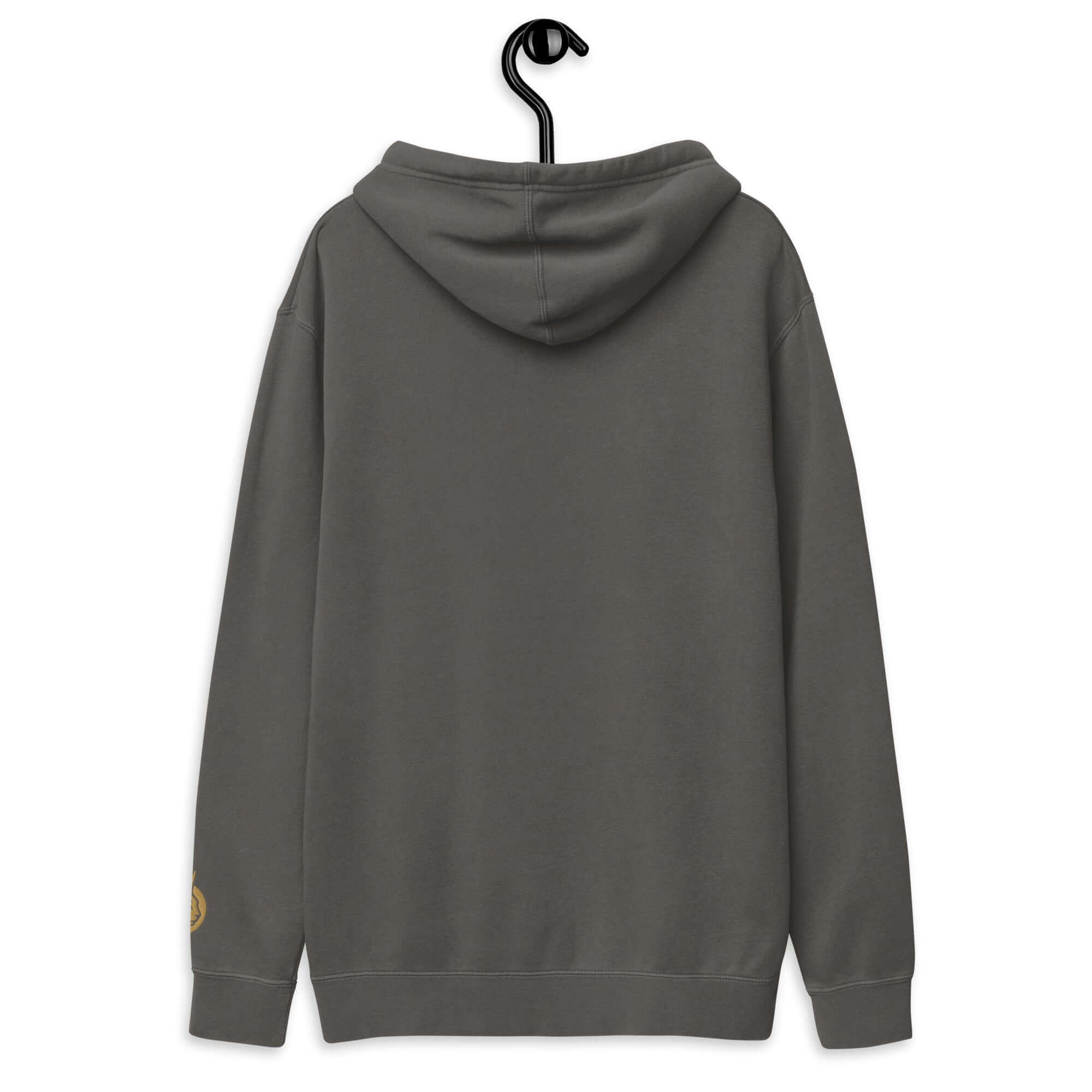 Back view of LynxDonkey Unisex pigment-dyed hoodie hanging on a display hook, showcasing its casual style.