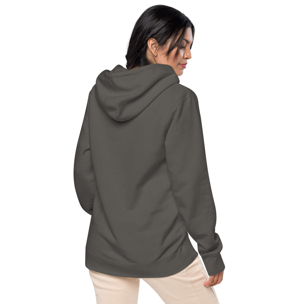 Back view of a woman wearing the LynxDonkey Unisex pigment-dyed hoodie in stylish design.