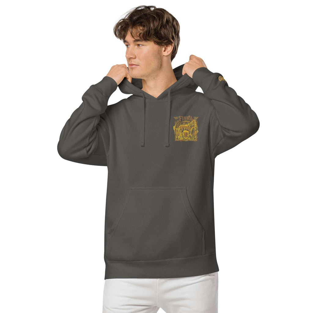 Model wearing LynxDonkey Unisex pigment-dyed hoodie in dark gray with unique vintage design.