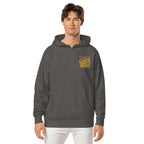 LynxDonkey Unisex pigment-dyed hoodie worn by a man, showcasing its unique vintage design and comfort.