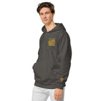 Image of a model wearing the LynxDonkey Unisex pigment-dyed hoodie in dark gray with a unique design.