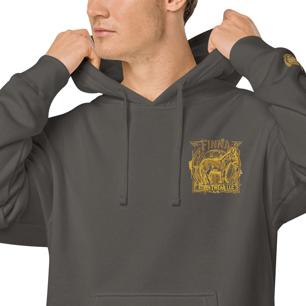 LynxDonkey Unisex pigment-dyed hoodie worn by a man showcasing its unique design and vintage aesthetic.